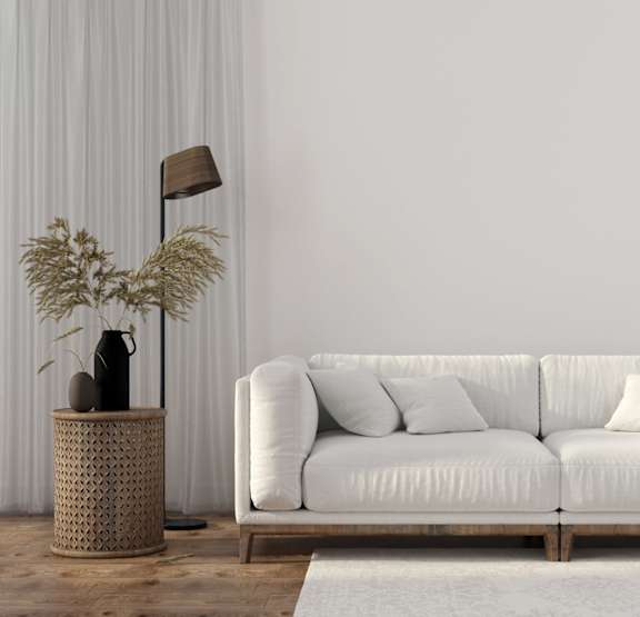 a bedroom with a bed and bookshelves     and a chair