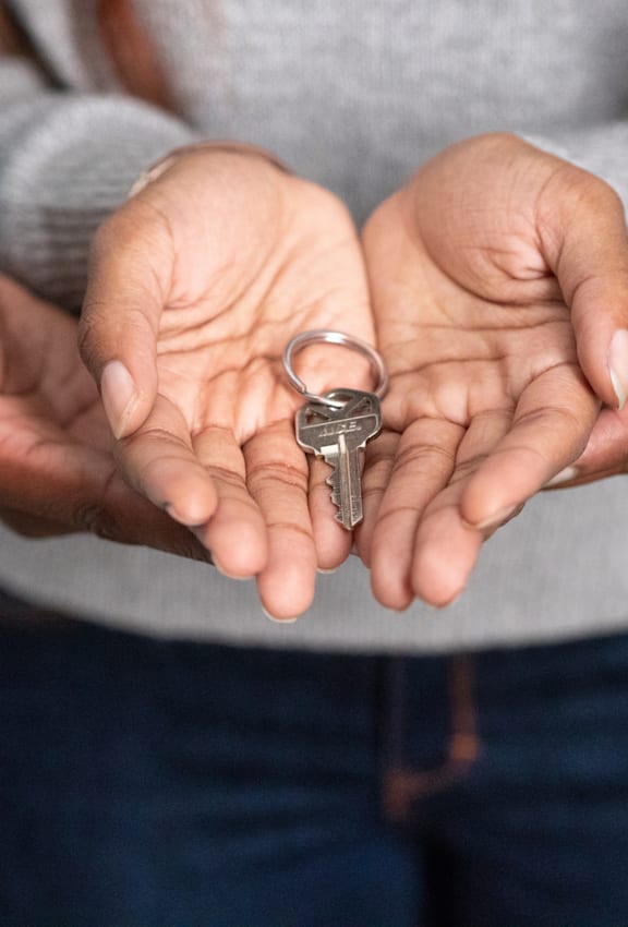 A person holding a ring in their hands.