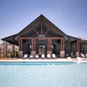 a house with a swimming pool in front of it