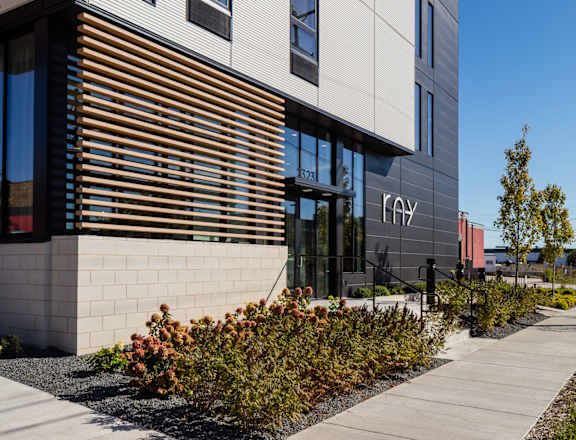 a sidewalk in front of a building with the word fay written on it