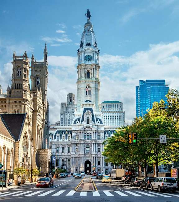 A large, ornate building with a clock tower dominates the skyline.