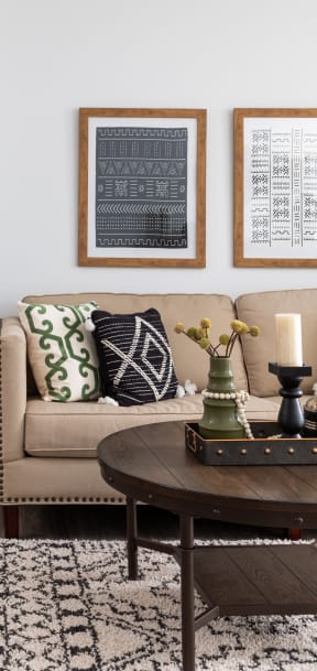 a living room with couches and chairs and a table