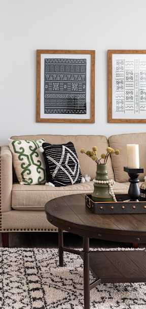 a living room with couches and chairs and a table