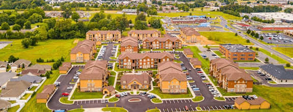 A bird's eye view of a housing complex with a central courtyard surrounded by buildings.