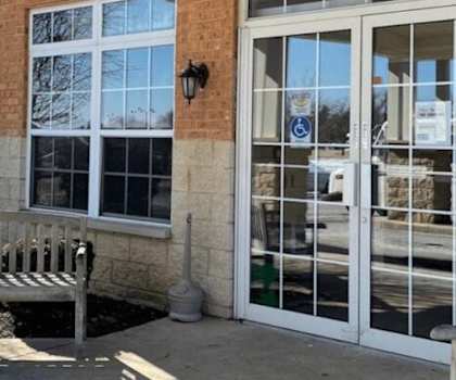 a bench sitting in front of a building