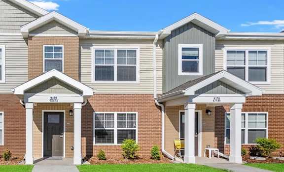 rows of apartment homes with individual portico entrances