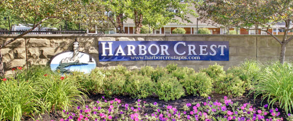 a sign forharbor crest in front of a building