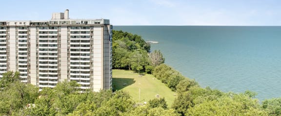 a view of a building next to a body of water