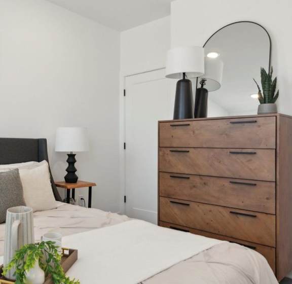A room with two white doors and a ceiling light.