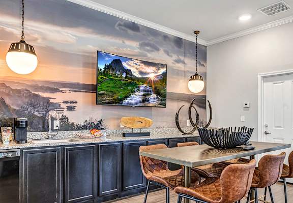 an open kitchen and dining room with a table and chairs