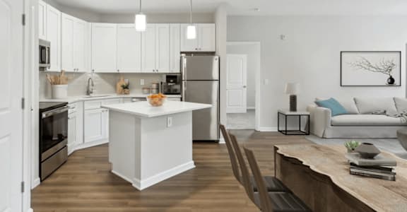 A modern kitchen with white cabinets at Two Addison Place, Pooler, GA