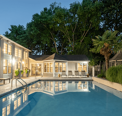 a house with a swimming pool in front of it