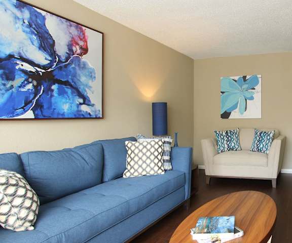 a living room filled with furniture and a flat screen tv