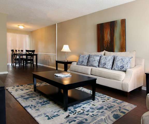 a living room filled with furniture and a flat screen tv