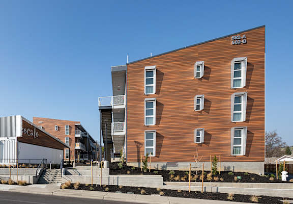 a large building with a wooden facade and a gray building next to it at ROCKY HILL VETERANS HOUSING, VACAVILLE California