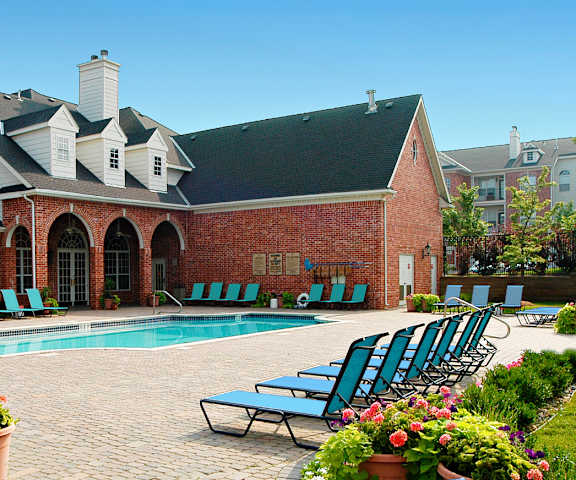 A large house with a pool in the backyard.