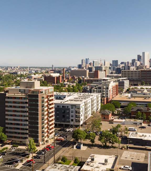 A cityscape with a clear blue sky above.