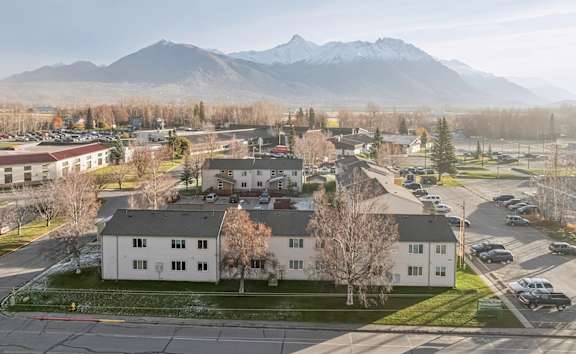 Father playing with kids in apartment at Northridge Terrace Apartments, Palmer, AK, 99645