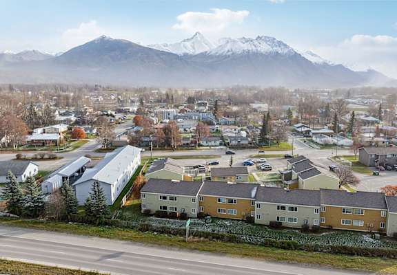 A small town with a mountain in the background.
