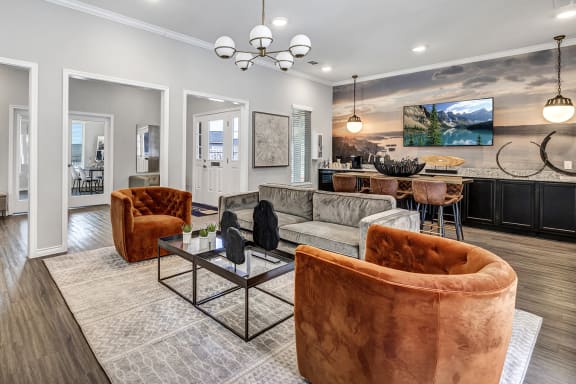 a living room with couches and chairs
