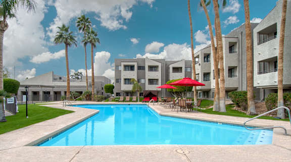 El Encanto Pool with lounge chairs and cabanas.