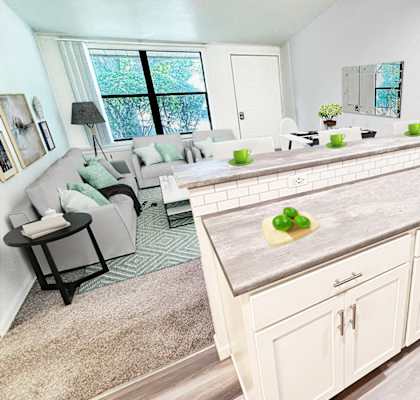 A kitchen with a large island and a dining table with chairs.