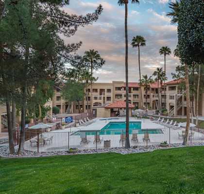 Foothills outside view with nice lush grass and trees throughout