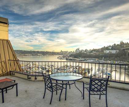A view of Seattle and Lake Washington with boats in the water and a bridge in the background at St. James Tower Apartments. 