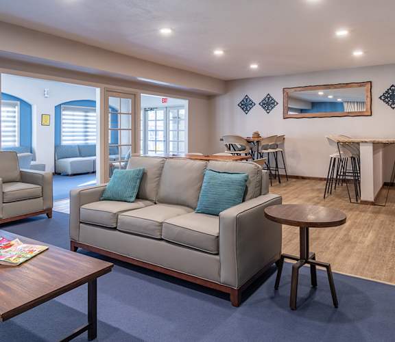 canyon oaks clubhouse with cozy couches and fireplace