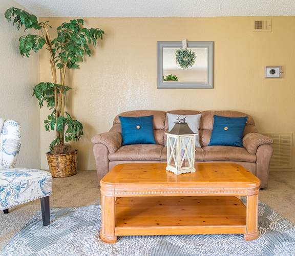 Somerpointe living room with carpet flooring and nice cozy chairs