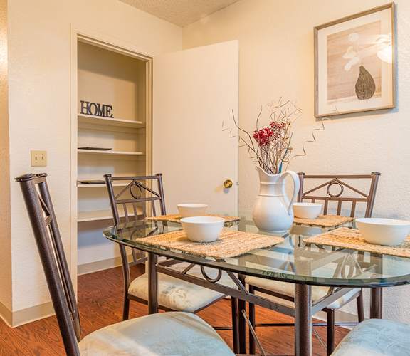 Somerpointe dining area with nice lighting and wood flooring