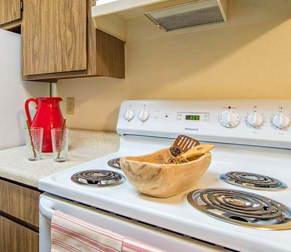 Tanglewood kitchens with electric stoves and matching appliances