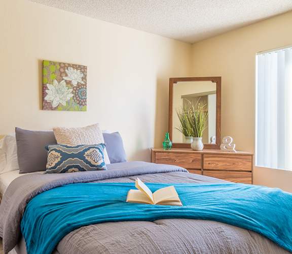 Sycamore Creek Spacious Bedroom with plenty of natural light, and drawers