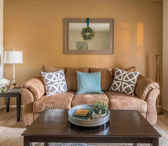Foothills living room with carpet flooring and a cozy couch