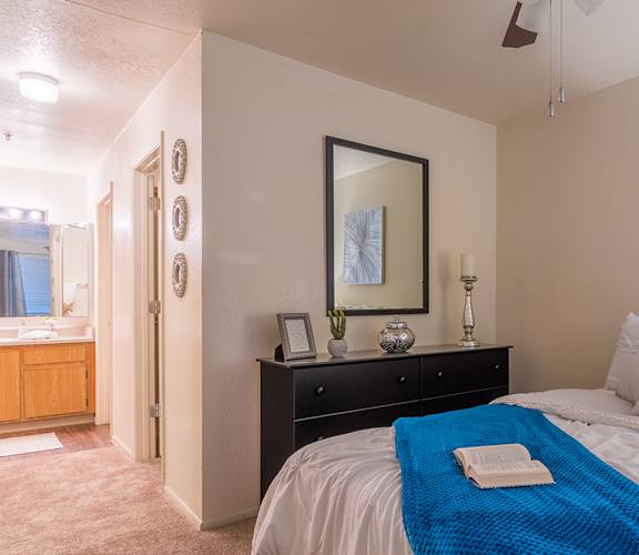 Estancia master bedroom with bathroom and nice lighting