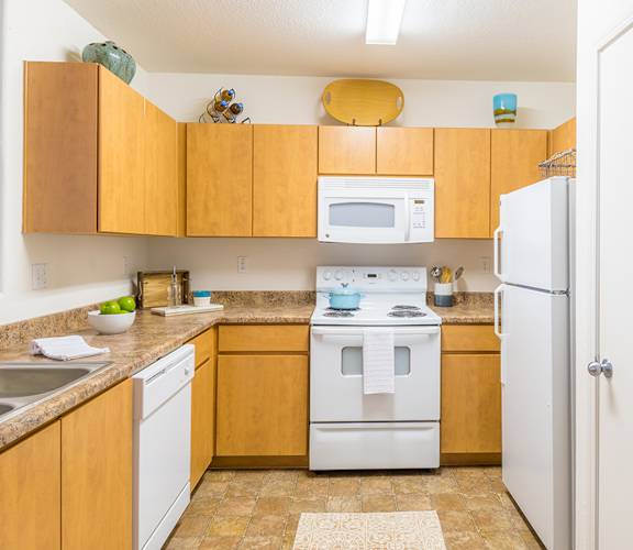 Desert Sands kitchen with all white appliances.