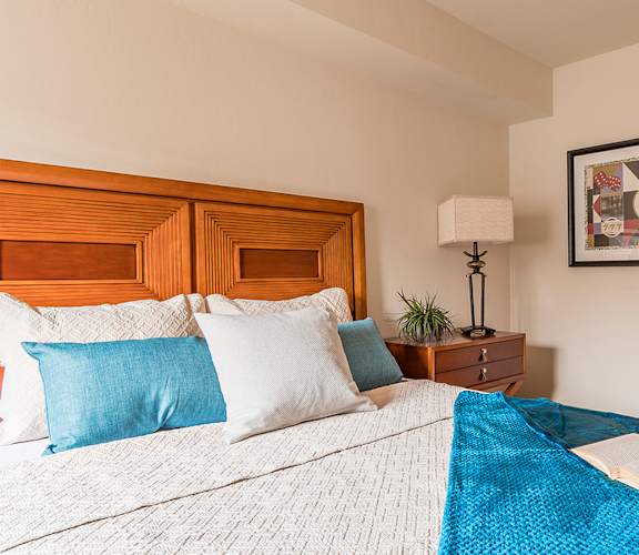 El Dorado Place bedroom with view into bathroom.