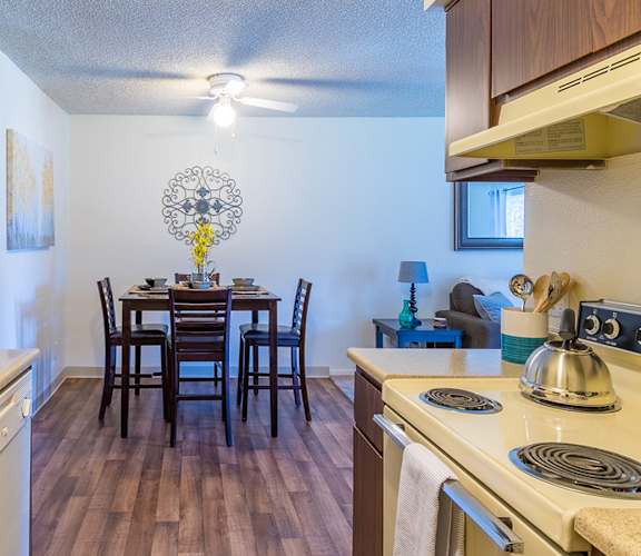 The Srpings view of kitchen and dining area with wood flooring