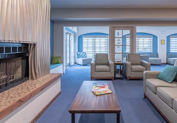 canyon oaks clubhouse with cozy couches and fireplace