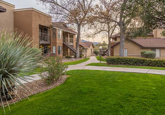 Arboretum view of apartments with lush landscape