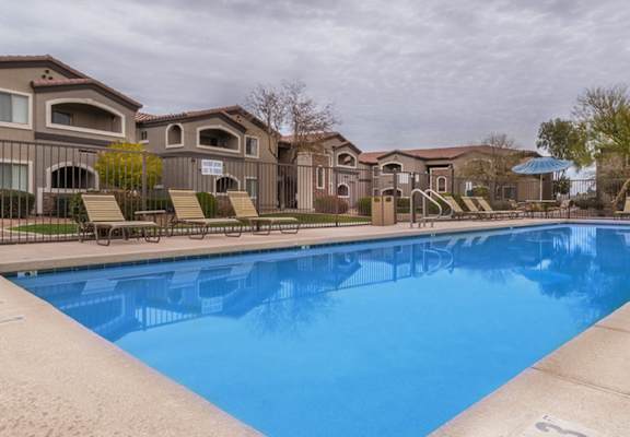 Desert Sands sparkling rectangular pool in the center of the apartment complex.