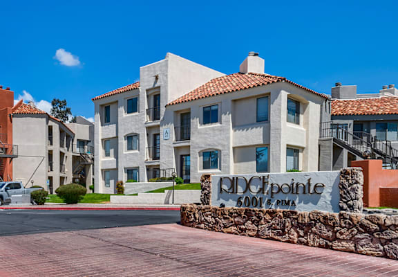 a building with a sign that reads old olympic boulevard on a street