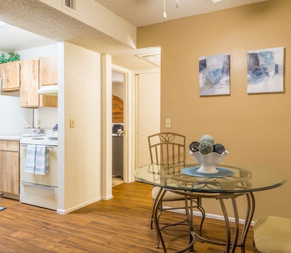 Riverstone dining area with ceiling fan and wood flooring