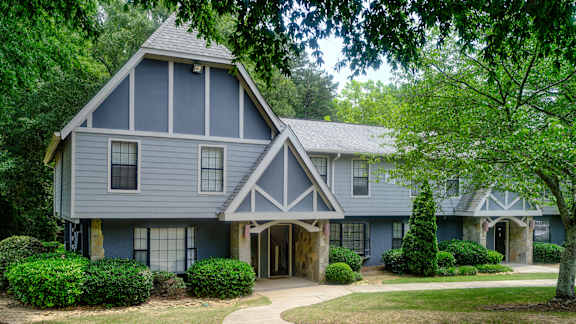 the front of a house with a blue and white house