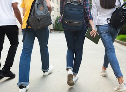 a group of people walking down a street