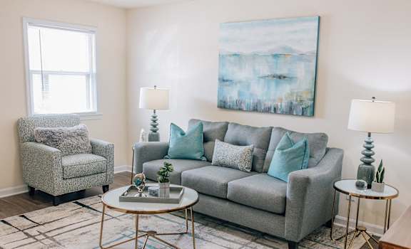 a living room with a couch and two chairs