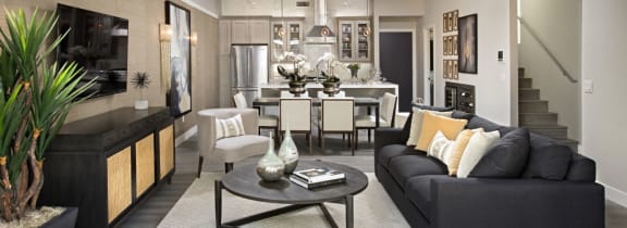 a kitchen with a large island and stainless steel appliances