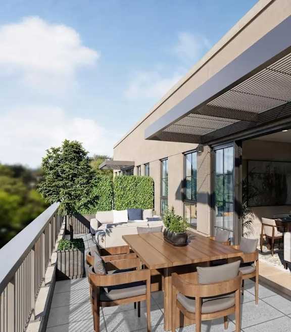 A balcony with a table and chairs is shown.