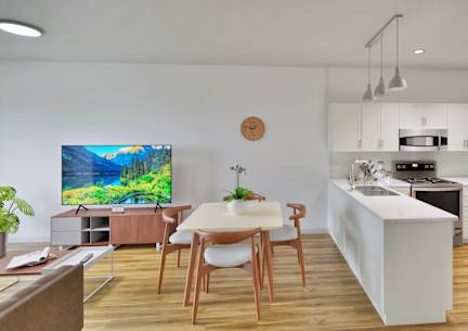 A modern kitchen with a dining table and chairs.