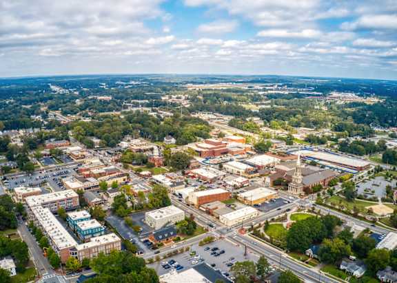 A small town with a large building in the center.